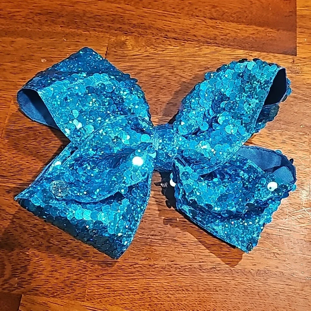 Like New girls JoJo Siwa blue/teal sequined large bow. BEAUTIFUL